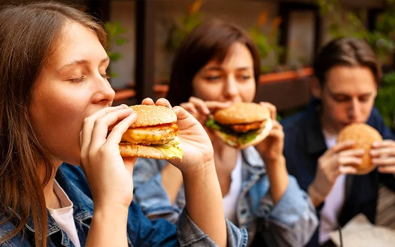 Customers eating burgers